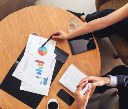 two-business-people-working-with-charts-around-tab-2024-09-13-01-07-33-utc.jpg